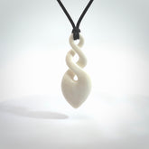 Hand carved bone double twist pendant. Beautiful hand made double twist bone necklace. Provided with an adjustable cord and packaged in a woven kete pouch. Free shipping worldwide.